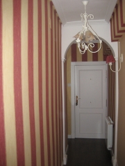 Colocacion de arco de escayola y  empelado de pasillo