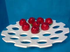 Frutero o centro de mesa redondo llano, con huecos para conservar mejor la fruta