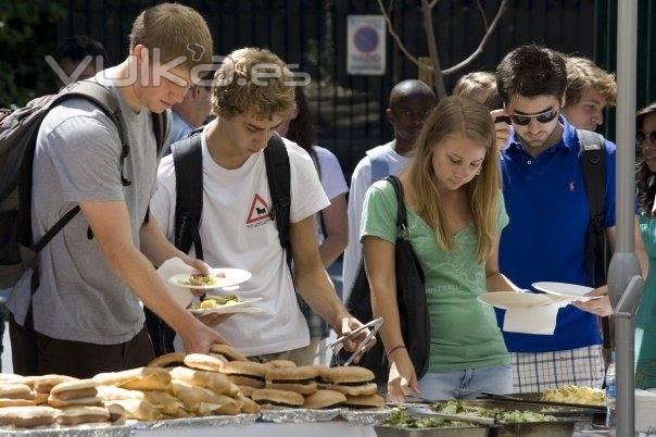 Students enjoy hamburgers and hot dogs at the Annual BBQ and Activities Fair.
