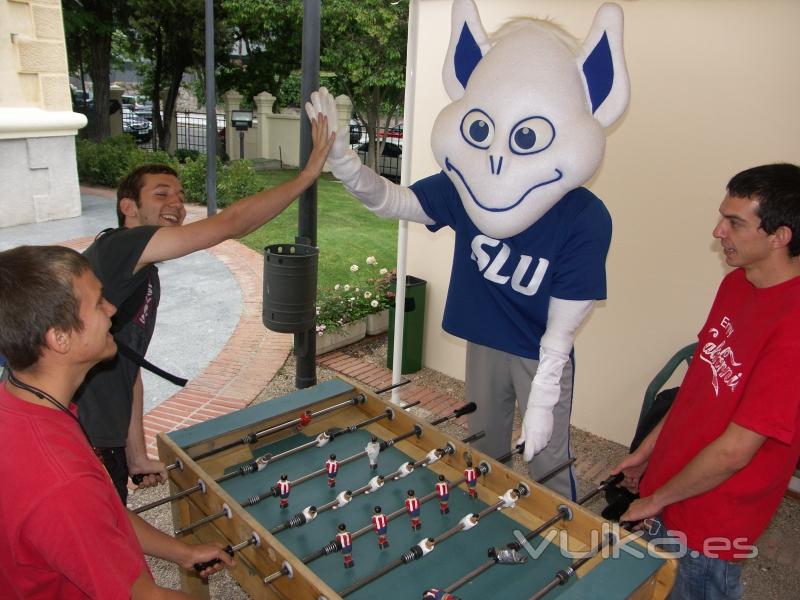 The Billiken joins students for a game of Futbolin, or foozball, and dominates.