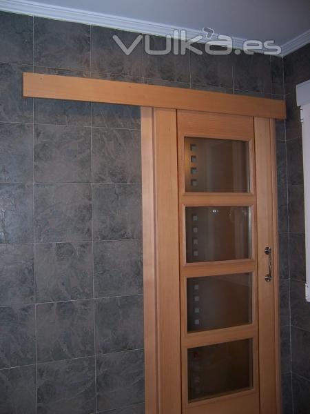 Puerta corredera adosada
