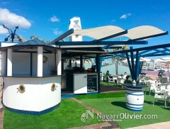 Casetas modulares desmontables en madera tratada con pergola adosada de sombraje en lona microperfor
