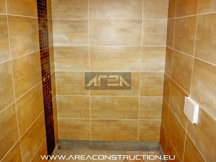 Colocacin gres porcelnico Corten Beige de Tau. Reforma bao Bacelona. Area Construction Technology