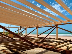 Estructura de madera laminada construida sobre forjado  soportado por pilotes en  playa de la barros