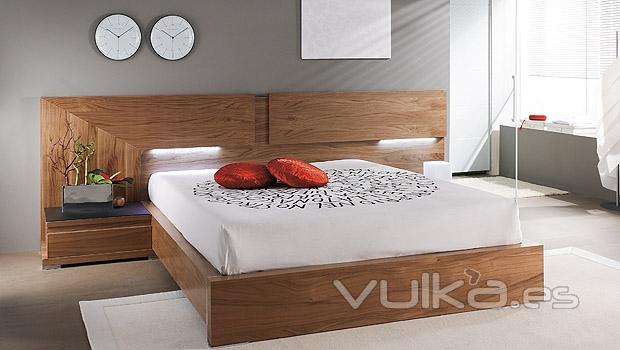 Dormitorio moderno en chapa natural color nogal con luz integrada