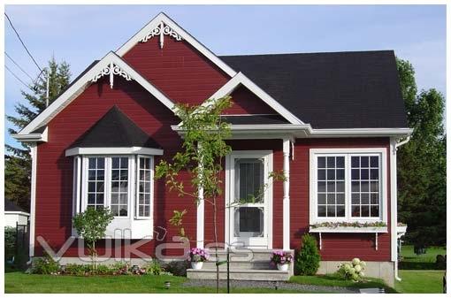 Foto: CASA DE MADERA CON REVESTIMIENTO EXTERIOR EN CANEXEL ROJO