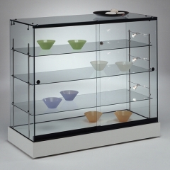 Vitrina/mostrador de vidrio con iluminacion, base melamina, puertas correderas